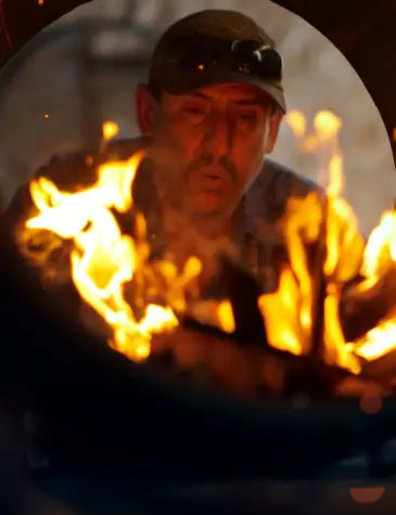 Man blowing on fire